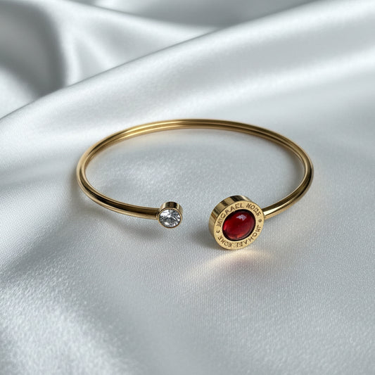 Gold-Tone Cuff Bracelet with Red Cabochon & Crystal Accent