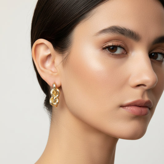 Elegance Unlinked: Twisted Gold Knot Statement Earrings