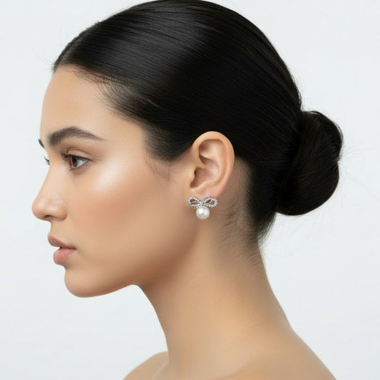 Sparkling Crystal Bow & Pearl Stud Earrings – Classic Silver-Tone Glamour