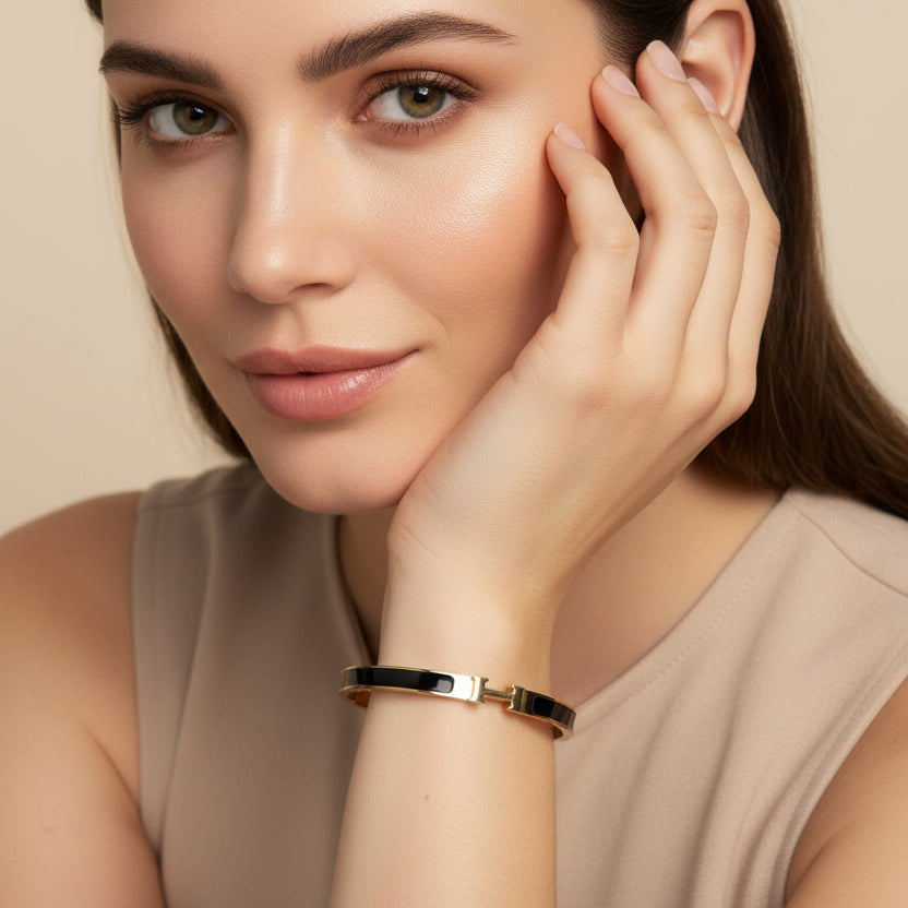 Classic Gold and Black Enamel Bangle – Iconic "H" Motif Hinged Bracelet